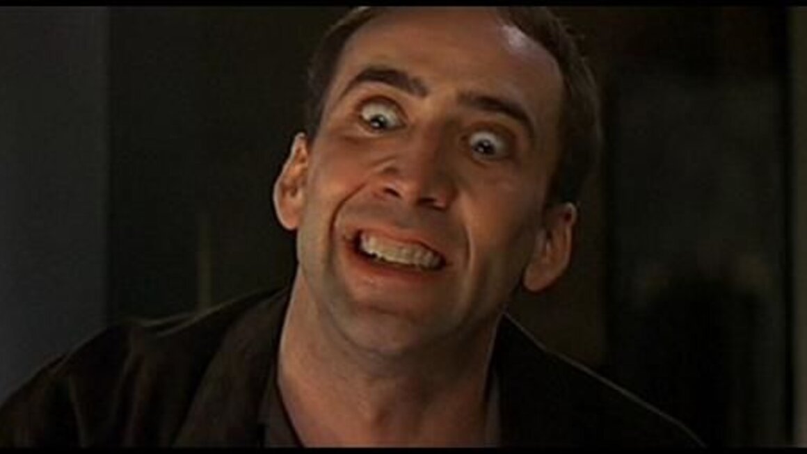 A very sober looking Nicholas Cage in the film Face-Off